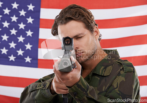 Image of Military, aim and gun with portrait of man shooting in studio for war, conflict and patriotic. Army, surveillance and security with person on usa flag for soldier, battlefield and American veteran