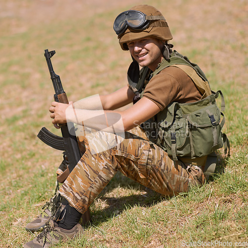 Image of Military, smile and training with man and gun in nature for war, conflict and patriotism. Army, surveillance and security rifle with person and relax on grass for soldier, battlefield and veteran