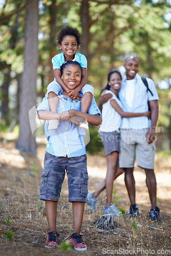 Image of Family, portrait or happy kids hiking in forest to relax or bond on holiday vacation together in nature. Sibling children, black people or African parents in woods trekking on outdoor adventure