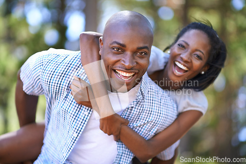 Image of Piggyback, portrait or happy black couple in forest to relax or bond on holiday vacation together in nature. Hiking, travel or African woman with smile, love or man in woods on outdoor park adventure