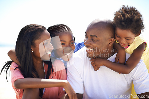 Image of Happy, love and black family at the beach together for tropical vacation, adventure or holiday. Smile, travel and young African parents with girl children by the ocean for bonding weekend trip.