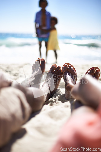 Image of Feet of family on beach, relax and holiday with children, waves and sunshine on tropical island travel together. Black man, woman and kids on ocean vacation in summer with adventure, peace and sky.