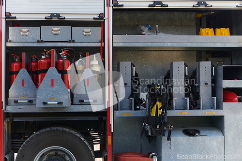 Image of Close-up of essential firefighting equipment on a modern firetruck, showcasing tools and gear ready for emergency response to hazardous fire situations