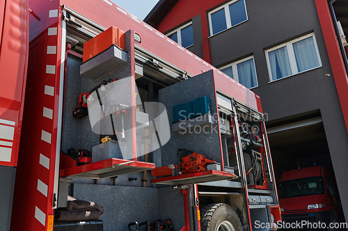 Image of Close-up of essential firefighting equipment on a modern firetruck, showcasing tools and gear ready for emergency response to hazardous fire situations