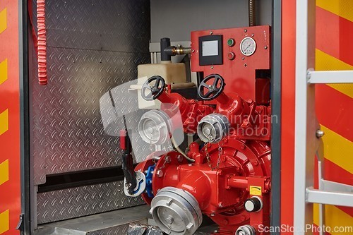 Image of Close-up of essential firefighting equipment on a modern firetruck, showcasing tools and gear ready for emergency response to hazardous fire situations