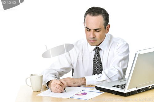 Image of Office worker studying reports