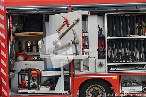 Image of Close-up of essential firefighting equipment on a modern firetruck, showcasing tools and gear ready for emergency response to hazardous fire situations