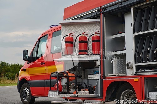 Image of Close-up of essential firefighting equipment on a modern firetruck, showcasing tools and gear ready for emergency response to hazardous fire situations