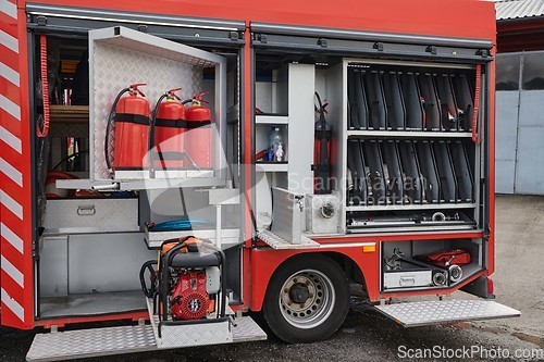 Image of Close-up of essential firefighting equipment on a modern firetruck, showcasing tools and gear ready for emergency response to hazardous fire situations