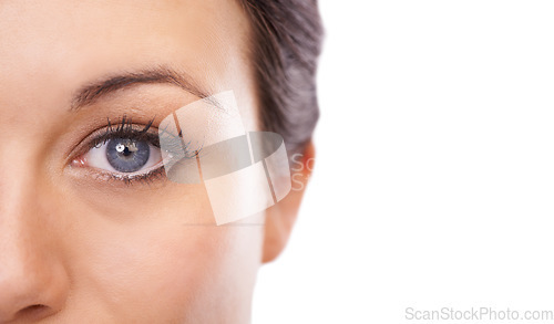 Image of Woman, face and eye on mockup space for sight, cosmetics or skincare against a white studio background. Closeup portrait of young female person, eyelash or model half staring with optical vision