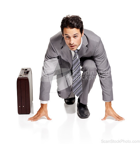 Image of Ready, run and portrait of businessman with briefcase in studio kneeling, confident or prepared on white background. Corporate, rat race and face of male entrepreneur with time management efficiency