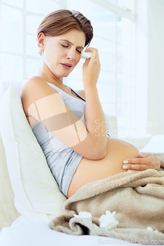 Image of Crying, tissue and pregnant woman in a bed with depression, worry or fear for the future at home. Maternity, anxiety or person in bedroom with pregnancy mood swings, hormones or overwhelmed in house
