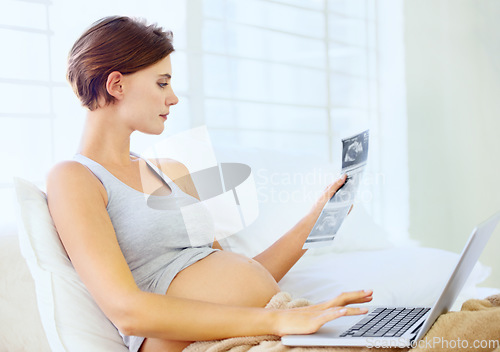 Image of Pregnant woman, laptop and ultrasound image in home with relax wellness and excited on prenatal care in bedroom. Person, love or sonogram photo with technology on bed, fetus growth or development