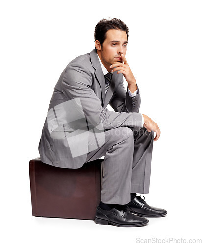 Image of Stress, thinking and business man with briefcase in studio for travel, fail or mistake on white background. Doubt, anxiety and person sitting on a bag with headache, disaster or compliance problem