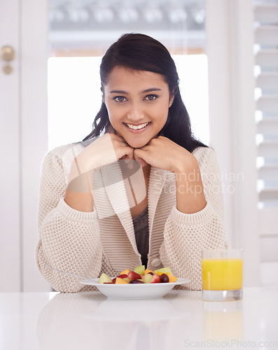 Image of Breakfast, happy and portrait of woman with fruit salad and juice for nutrition, wellness and diet. Morning, home and person with drink, healthy food and snack for detox, vitamins and organic meal