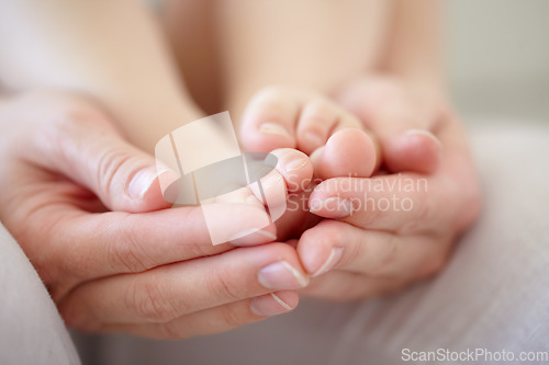 Image of Love, mother and hands with baby or feet for development, nurture and bonding in nursery of apartment. Family, woman or newborn toes with relax, support or care for relationship or motherhood in home