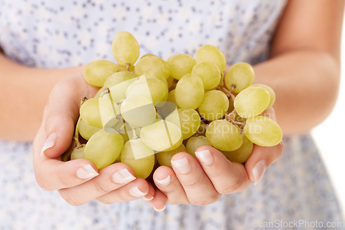 Image of Health, hands and closeup of woman with grapes in a studio for detox, vegan diet and fresh ingredient. Wellness, nutrition and zoom of female model with organic fruit for vitamins by white background