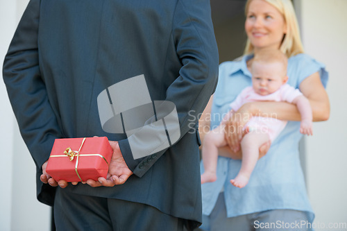 Image of Husband, wife and hiding gift box for surprise, look and happiness with baby, love and appreciation. Present, romance and good news for marriage, relationship and announcement with romantic partner