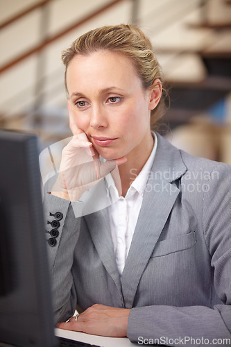 Image of Bored, office and business woman on computer for online proposal, internet and research at desk. Corporate, burnout and tired worker annoyed, frustrated and thinking for working, job and career