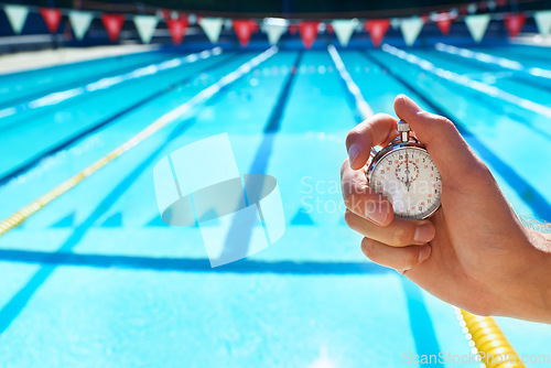 Image of Hand, timer and swimming pool for sport, training and workout with preparation for competition. Person, coach or mentor with clock, stopwatch or check for speed, progress and tracking lap for race