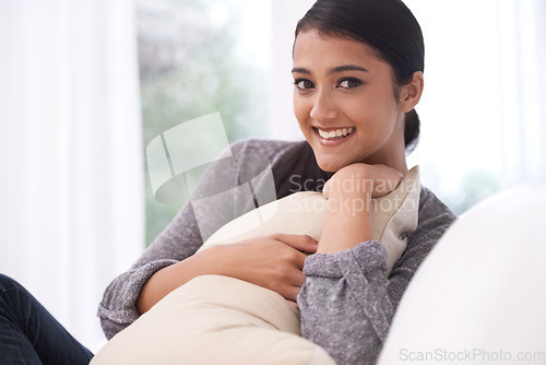 Image of Relax, woman and sofa pillow with portrait, smile and happy with rest in the morning at home. Living room, lounge and couch with a female person from India on a break with peace and calm in house