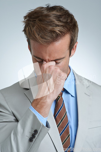 Image of Businessman, headache and stress in studio for debt, mental health and bankrupt or burnout. Male person, migraine and frustrated by white background, deadline and depression or mistake and tension