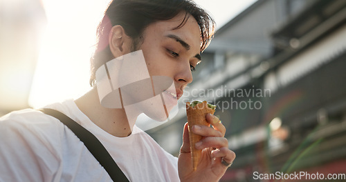 Image of Ice cream, eating and Japanese man in city on vacation, holiday and adventure in Yokohama town. Travel, weekend trip and person with dessert, sweet snack and cone in street for tourism destination