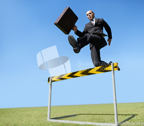 Image of Businessman, hurdle and jumping for career challenge or competition or employee obstacles, growth or achievement. Male person, briefcase and leap at work for professional goals, overcome or milestone