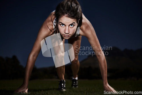 Image of Woman, portrait and runner start line for training for marathon race at night, performance or endurance. Female person, face and exercise in dark or cardio activity or fitness, workout or practice