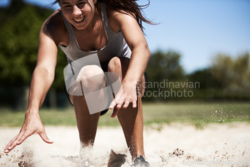 Image of Woman, sand and long jump athlete outdoor training for endurance competition, skill or performance. Female person, face and fitness goal for cardio achievement practice or leap run, wellness or sport