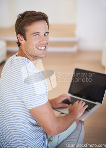 Image of Man, portrait and laptop or home for remote work as copywriter for problem solving, brain storming or research. Male person, face and happy web browsing for online blog connection, email or internet