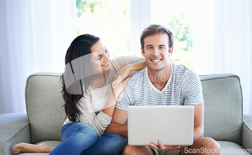 Image of Couple, love and relax on sofa with laptop, living room and marriage for care bonding on weekend. Woman, man and romantic for relationship with streaming internet, commitment and happy in apartment