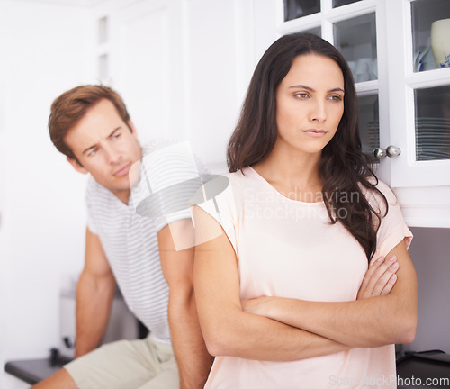 Image of Angry, woman and man fight with conflict or drama in life, mistake or marriage fail, anxiety and stress at home. Frustrated couple argue in kitchen, cheating problem or crisis with risk of divorce