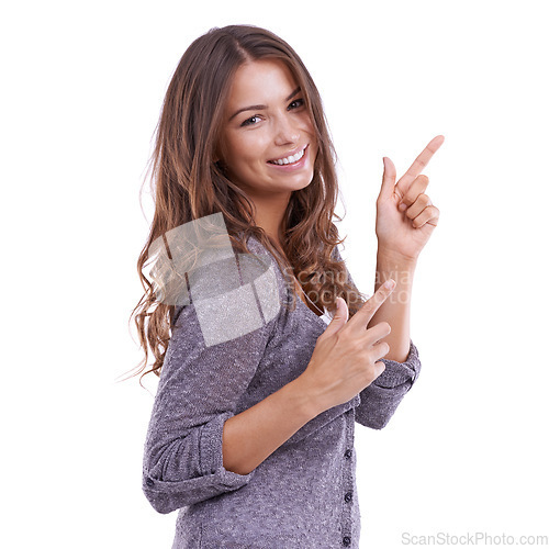 Image of Pointing, portrait and happy woman with finger gun gesture at discount opportunity, sales notification or ads. Happiness, coming soon and studio model smile for news presentation on white background