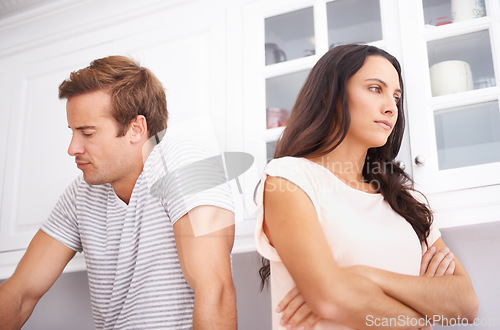 Image of Couple, fight and angry with conflict or crisis in life, mistake or marriage fail with anxiety and stress at home. Frustrated people arguing in kitchen, cheating or problem with risk of divorce