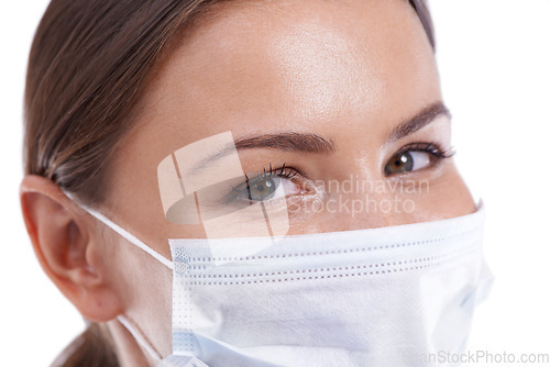 Image of Healthcare, woman doctor and portrait with face mask in studio for safety from illness or bacteria on white background. Friendly, medical or eyes of nurse at hospital with cover for clinic compliance