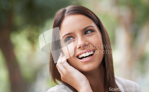 Image of Woman, phone call and conversation in park for good news, connection or gossip. Female person, digital device and smile in nature for speaking communication for advice chat, information or discussion
