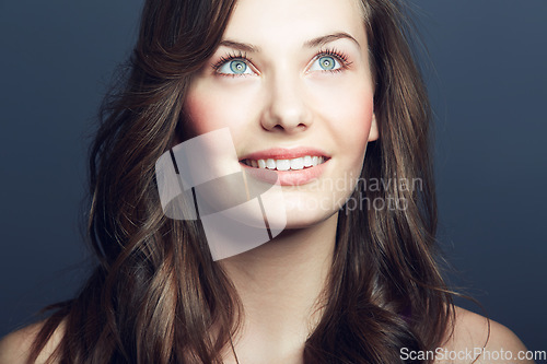 Image of Woman, hair and natural beauty with cosmetic care, salon hairstyle and grooming on grey background. Happy, thinking with wellness and dermatology for skincare with growth and haircare in studio