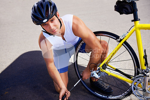 Image of Man, portrait and cycling or tyre pump for repair puncture on road for safety, performance or transportation. Male person, face and bicycle gear problem fix for triathlon training, practice or sport