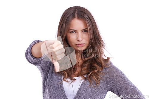 Image of Thumbs down, portrait and hands of woman in studio for rejection of bad news, emoji sign and vote no for feedback on white background. Unhappy model show negative review, wrong decision and failure