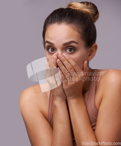 Image of Woman, shocked and portrait with mouth closed, wow or secret with hands, gossip on studio background. Surprise, news and omg for rumor, announcement and information with face, confession or wtf