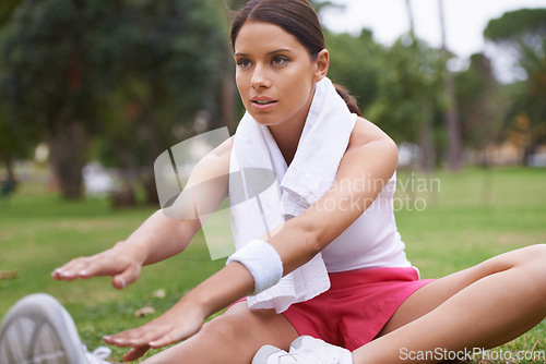 Image of Fitness, park or sports woman stretching in running training, cardio exercise or outdoor workout. Nature, legs or healthy girl runner with towel, ready to start activity for wellness a slim body