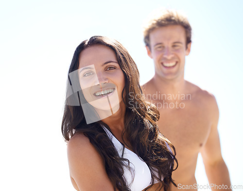 Image of Portrait, summer and love with couple on beach together for holiday, vacation or romantic getaway. Smile, travel or dating with happy young man and woman by ocean or sea for coastal adventure