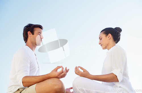 Image of Outdoor yoga, sky or couple meditation for spiritual peace, mental health or morning stress relief exercise. Freedom, sunshine or people meditate with eyes closed for calm, zen mindset or mindfulness