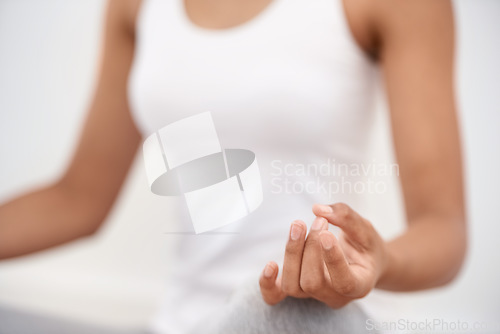 Image of Woman, hands and meditation for yoga, zen or exercise in spiritual wellness or inner peace at home. Closeup of calm female person or yogi meditating in relax for awareness or mental health at house