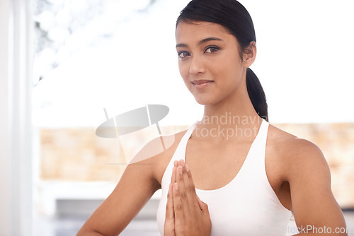 Image of Prayer hands, yoga and portrait of woman in home for pilates exercise, body health or wellness. Namaste pose, pranayama and a person or girl relax, physical activity or balance for fitness practice