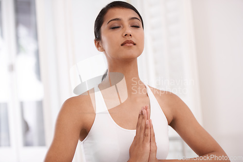 Image of Woman, meditation and namaste for zen, exercise or yoga in spiritual wellness or inner peace at home. Young and calm female person or yogi meditating in relax for awareness or mental health at house