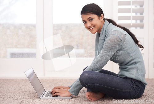 Image of Young, woman and laptop, student typing essay or assignment for college course and smile in portrait. Technology, email and connectivity, internet and research for education and learning at home