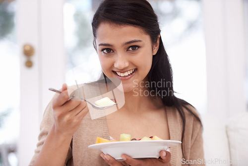 Image of Happy woman, portrait and bowl of fruit salad for vitamin C, nutrition or healthy snack at home. Face of young female person, nutritionist or vegan smile for eating breakfast, diet or meal at house