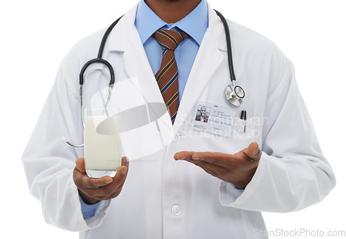 Image of Doctor, hands and studio person with milk for wellness diet, healthcare nutrition or calcium benefits. Beverage glass, hydration drink and closeup nurse show dairy recommendation on white background